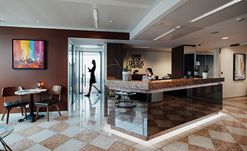 Receptionist helping clients at the front desk